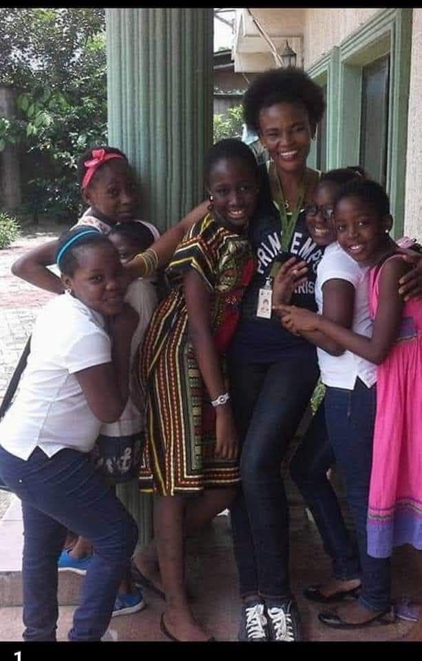 Lucy with a group of young girls