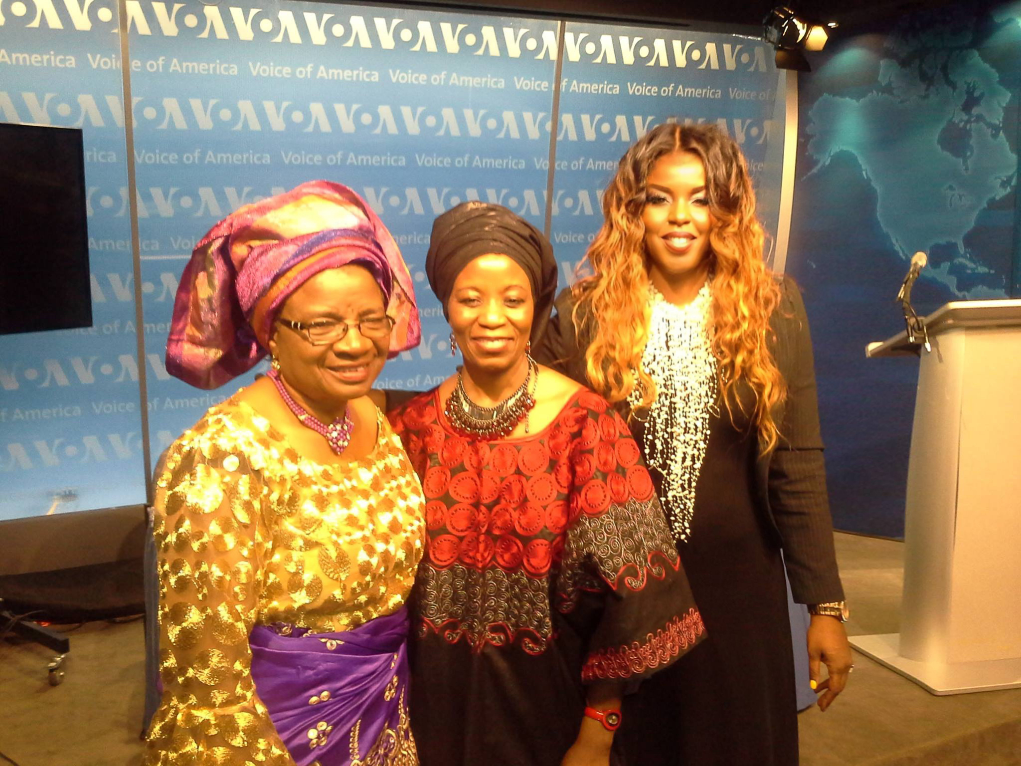 Sandra Ekpenyong with fellow advocates in traditional headwraps at VOA
